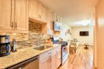 Recently remodeled kitchen with new appliances, gas range, and granite counters